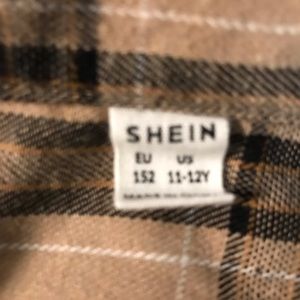 This is a size 11-12 youth. Plaid crop jacket.
